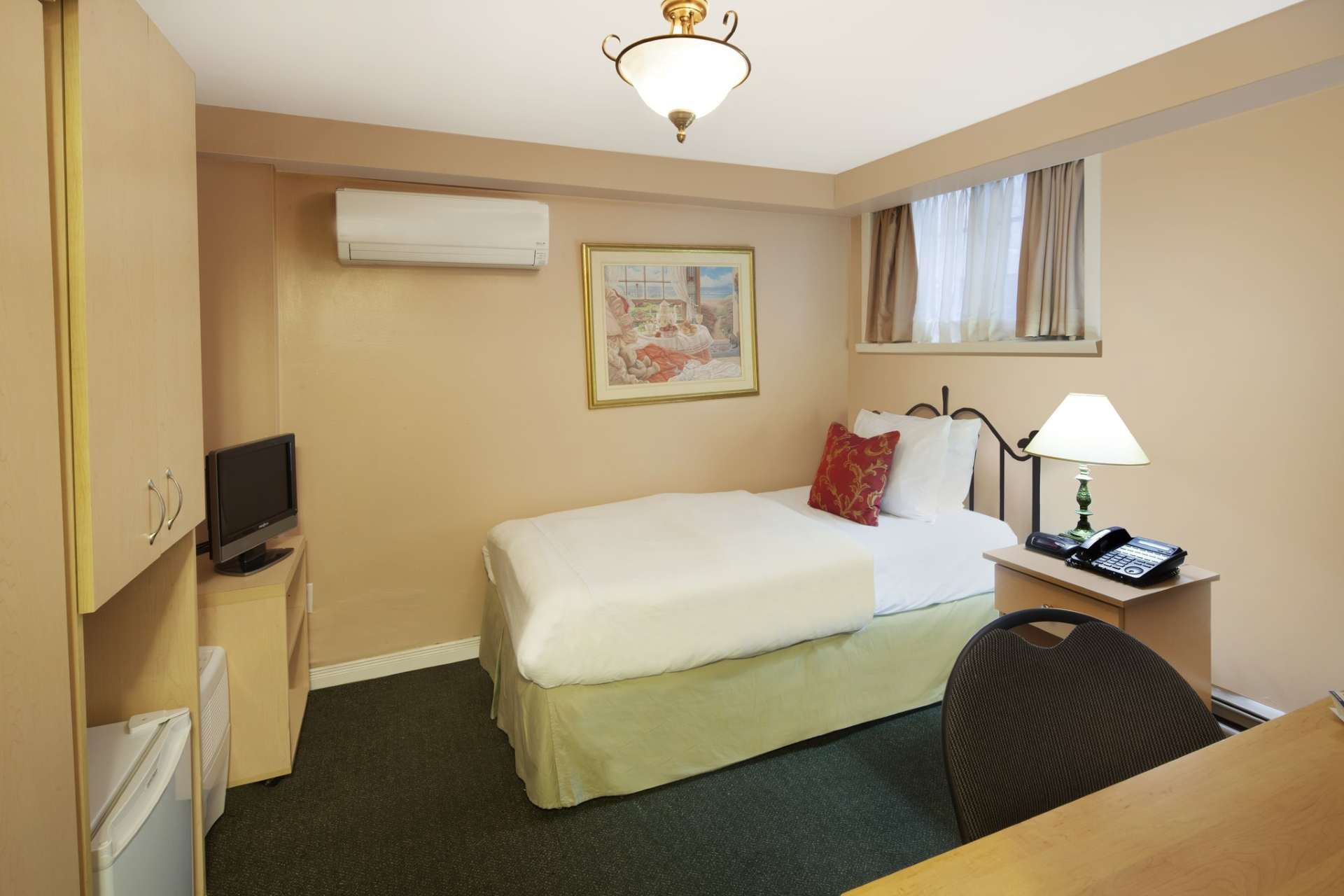 Guest room with one single bed beside a nightstand